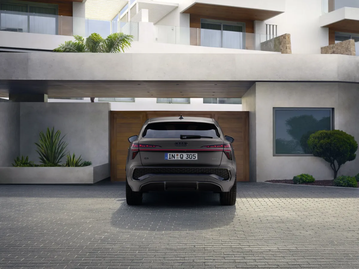 Audi Q3 Sportback from the rear, in front of a modern house