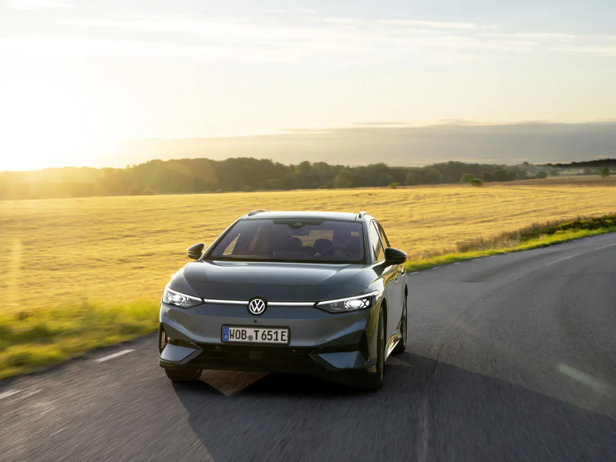 Volkswagen ID.7 Tourer front view, among fields