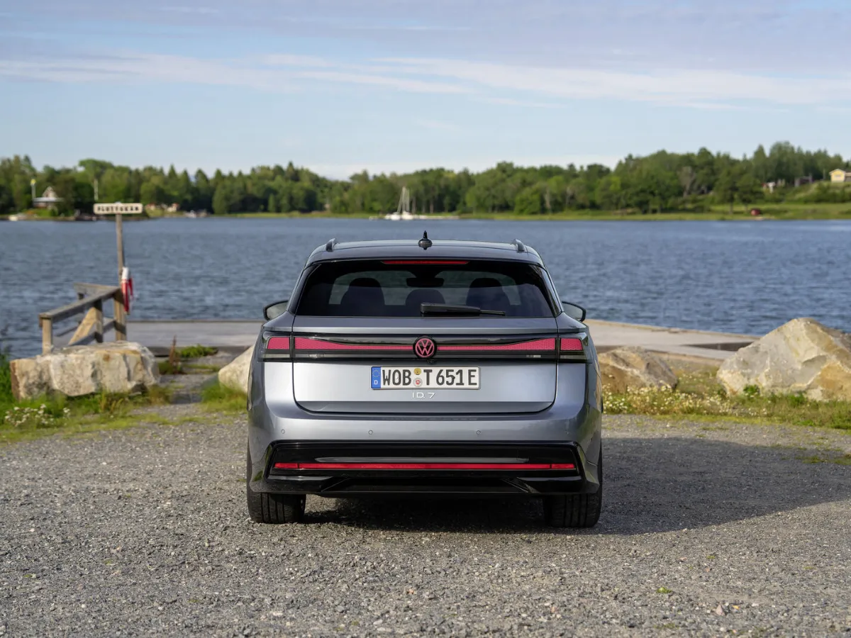 Volkswagen ID.7 Tourer from the rear, by a lake
